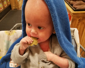 child eating raw crackers