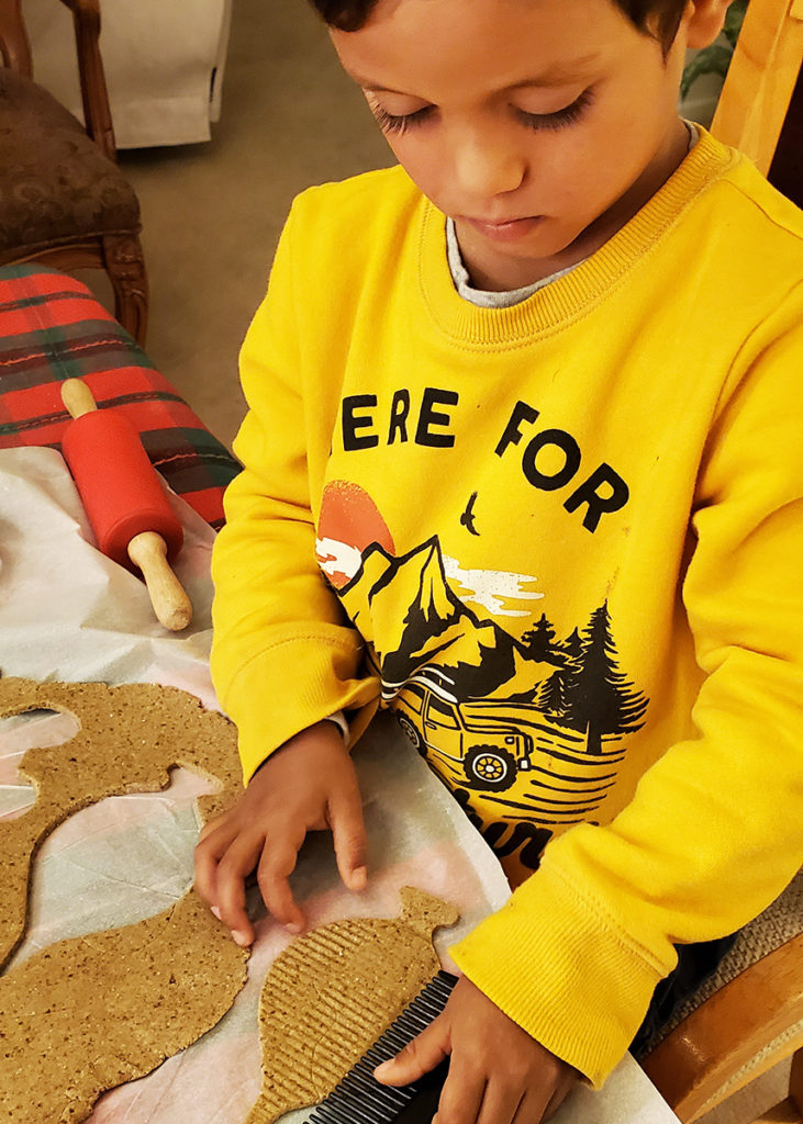 Lucas decorating cookies